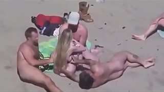 Wife jerks off strangers on nude beach